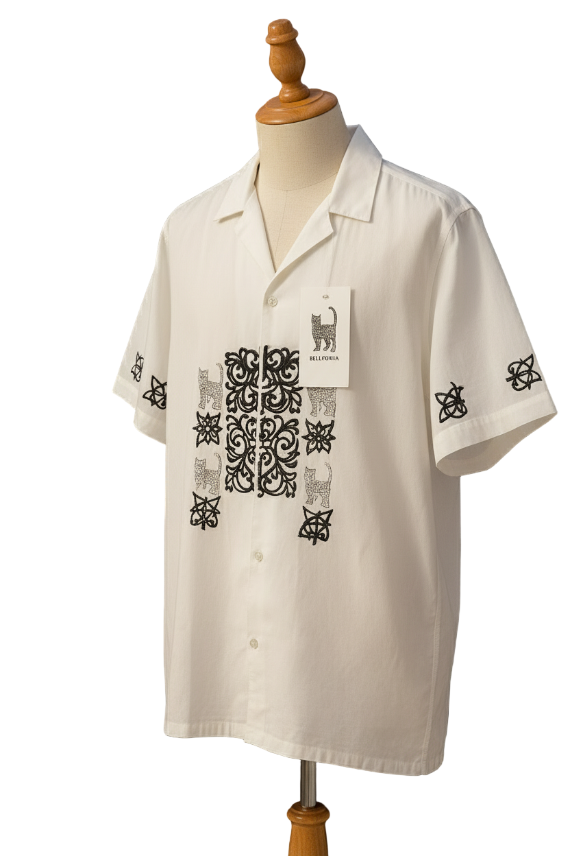 Belleoria Signature Motif shirt with black floral and cat motifs, on a wooden clothing stand. 